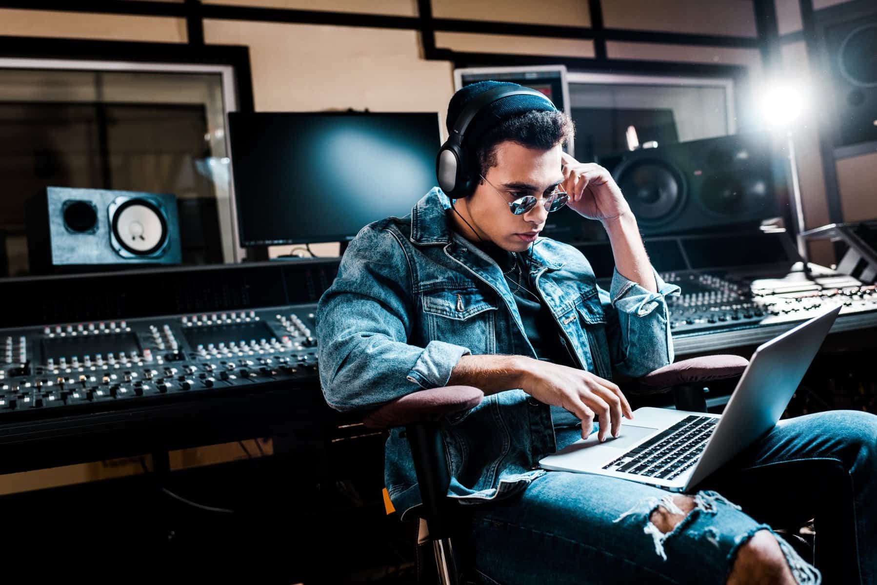 How Many EQ Plugins Do You Need? Image of a concentrated producer in recording studio